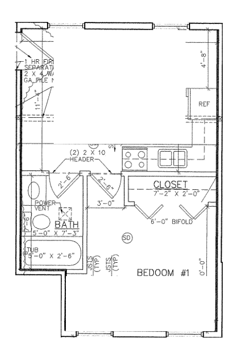 A floor plan of a small apartment with a bedroom, bathroom, and closet.